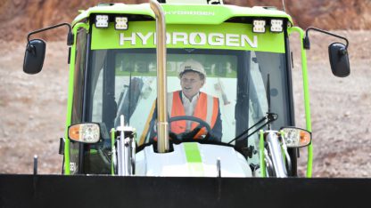 Grant Shapps has challenged Lord Bamford to deliver hydrogen-powered machines within a year.
