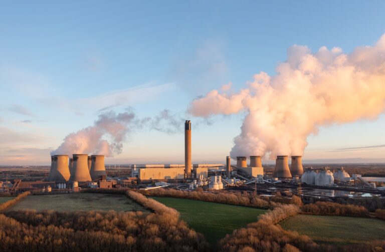 Drax coal fired power station in UK with coal stack and biofuel storage tanks