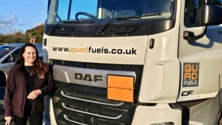 ANdrea Pitts of QUad FUels next to a tanker