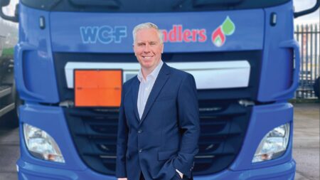 Phil Murray of WCF standing in front of fuel tanker