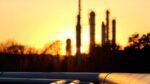 Oil refinery at sunset