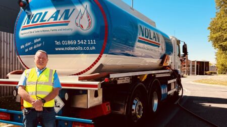 Image of Mark Nolan standing in front of fuel tanker