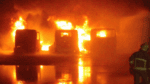 Image of vehicles on fire in yard